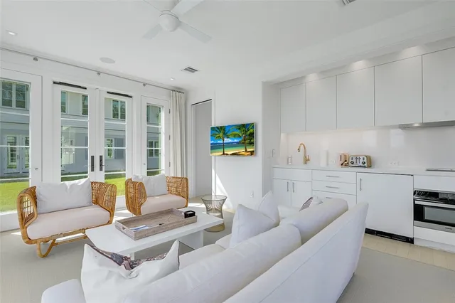 a living room with furniture and a stove