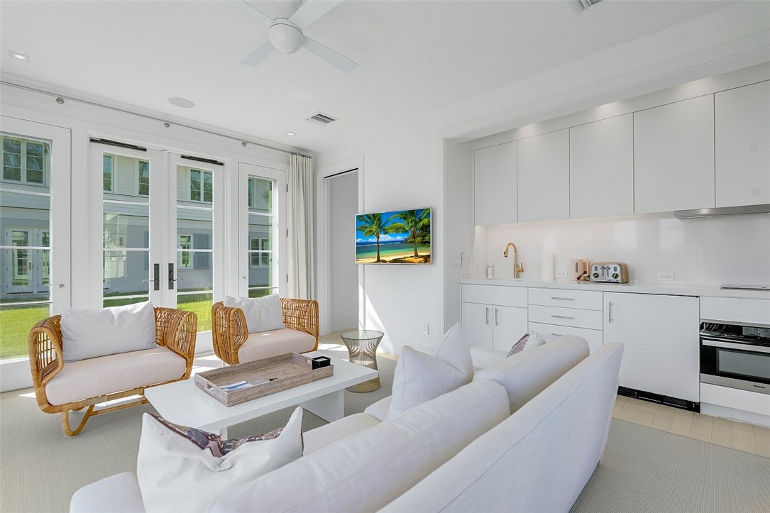 3340 Savannah Drive Vero Beach, FL 32963 - Photo 29 of 35 a living room with furniture and a stove