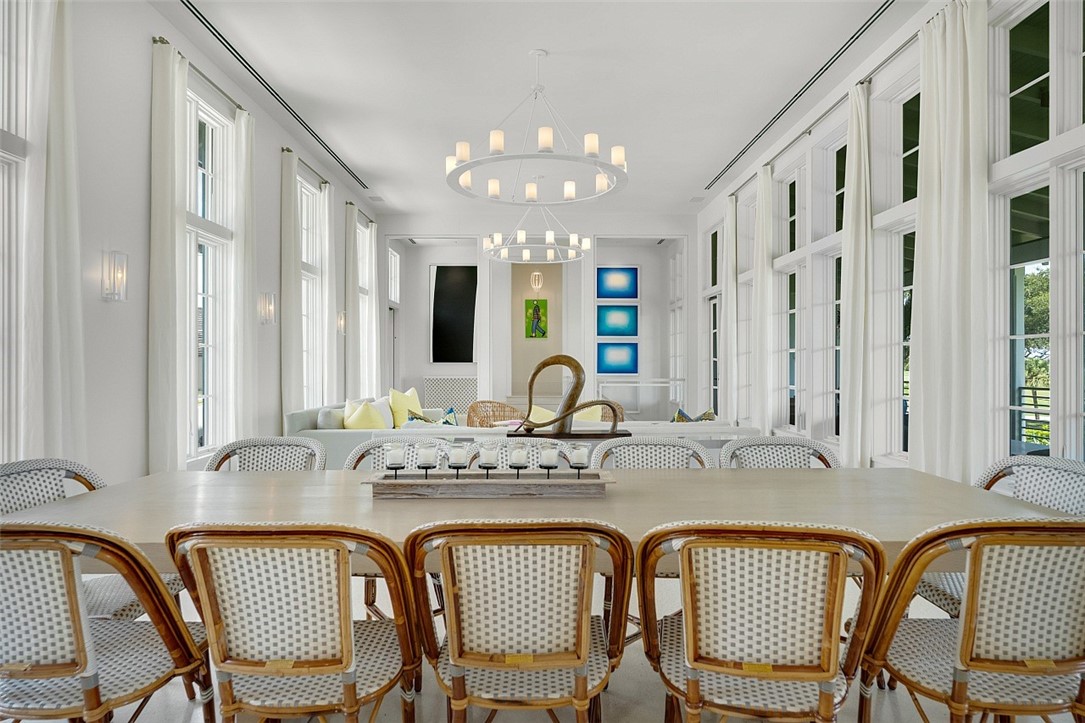 3340 Savannah Drive Vero Beach, FL 32963 - Photo 3 of 35 a view of a dining room with furniture and chandelier