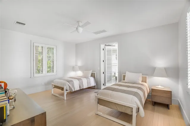 a bedroom with bed and a window