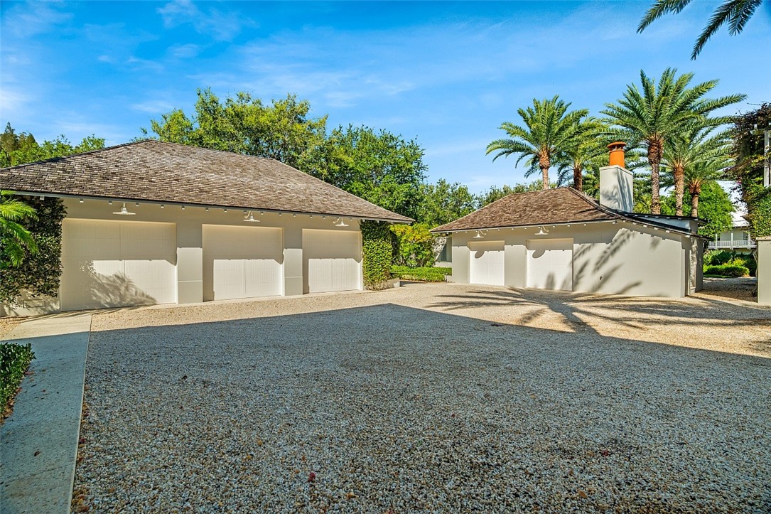 3340 Savannah Drive Vero Beach, FL 32963 - Photo 34 of 35 a house with trees in the background