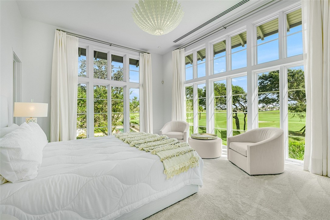 3340 Savannah Drive Vero Beach, FL 32963 - Photo 8 of 35 a bedroom with a bed and a large window