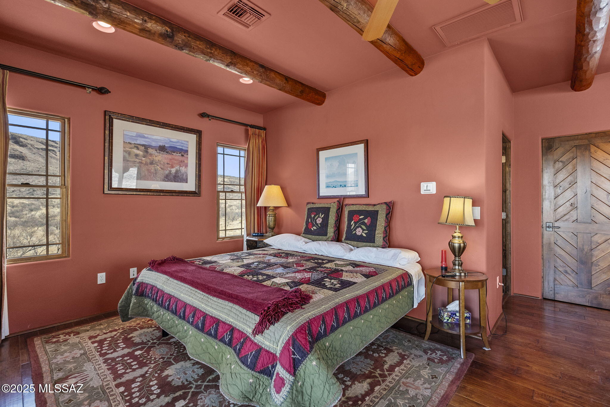 1265 Morning Star Drive Rio Rico, AZ 85648 - Photo 24 of 50 a bedroom with a bed and wooden floor