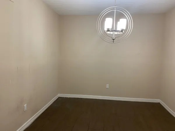 an empty room with a mirror