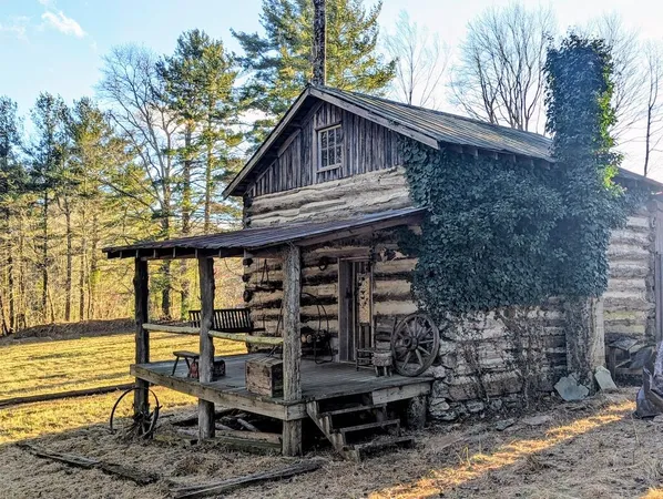 a view of a chair and table in the backyard