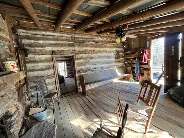 a view of livingroom with furniture wooden floor and windows