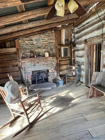 a room with fireplace furniture and a fireplace
