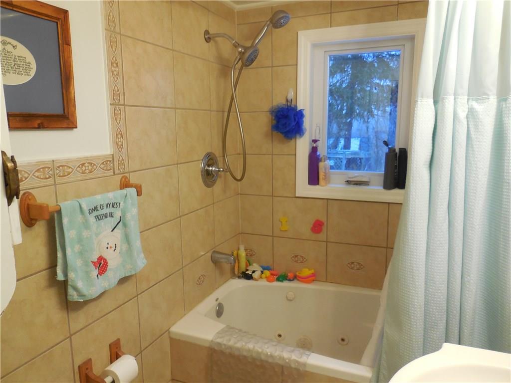 551 Allendale Road Rochester, PA 15074 - Photo 7 of 22 Updated main bathroom has new window, vanity, dual shower heads, faucet and toilet.