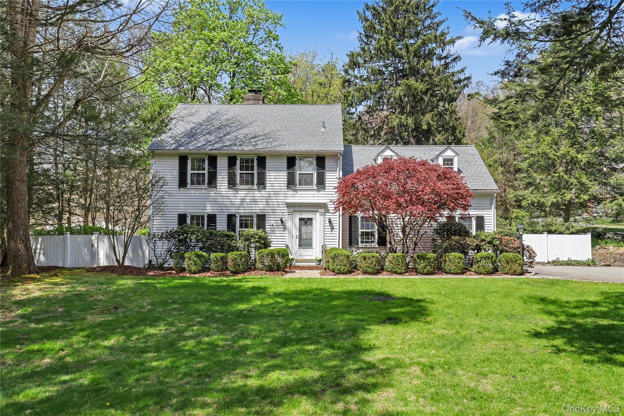 576 Old Post Road Bedford, NY 10506 - Photo 1 of 29 a front view of a house with garden