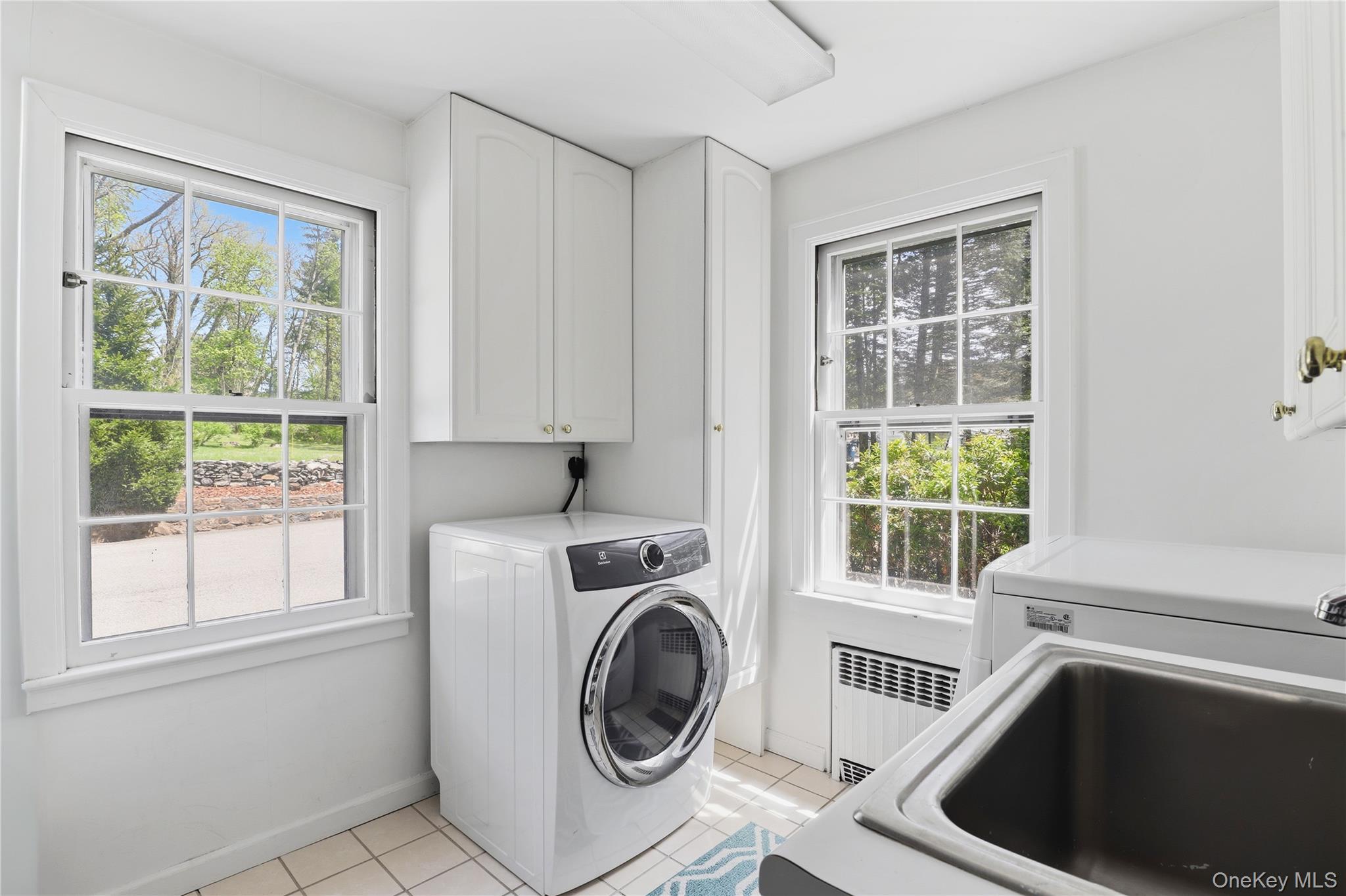 576 Old Post Road Bedford, NY 10506 - Photo 14 of 29 a utility room with dryer and washer