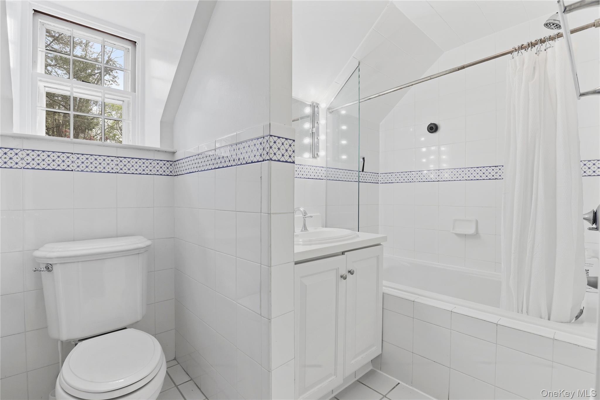 576 Old Post Road Bedford, NY 10506 - Photo 22 of 29 a bathroom with a toilet a sink and shower
