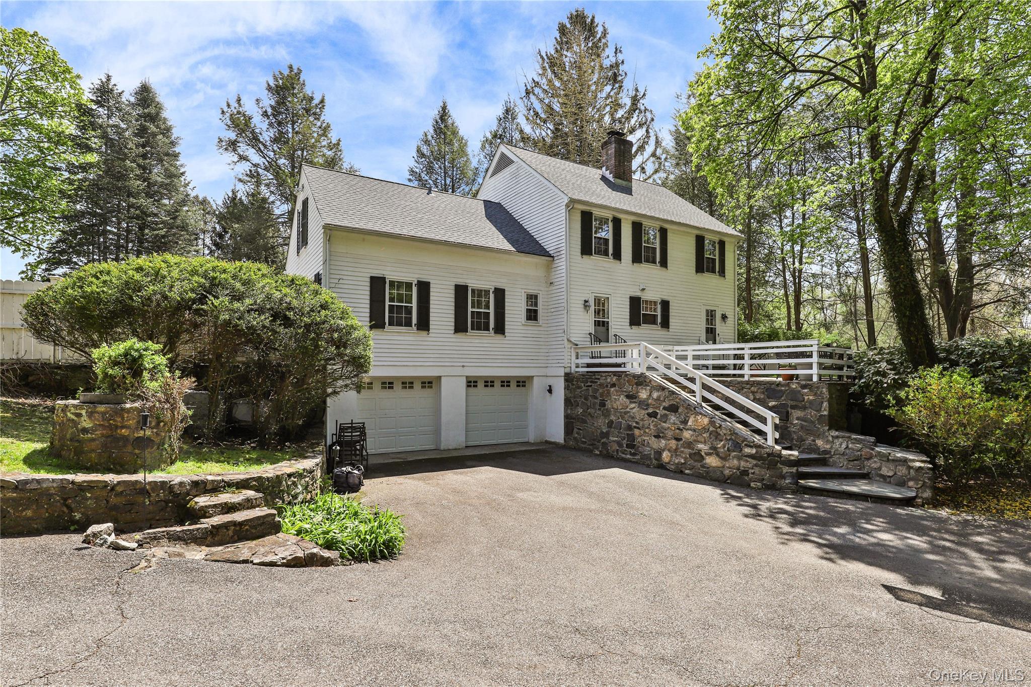 576 Old Post Road Bedford, NY 10506 - Photo 26 of 29 front view of a house with a yard