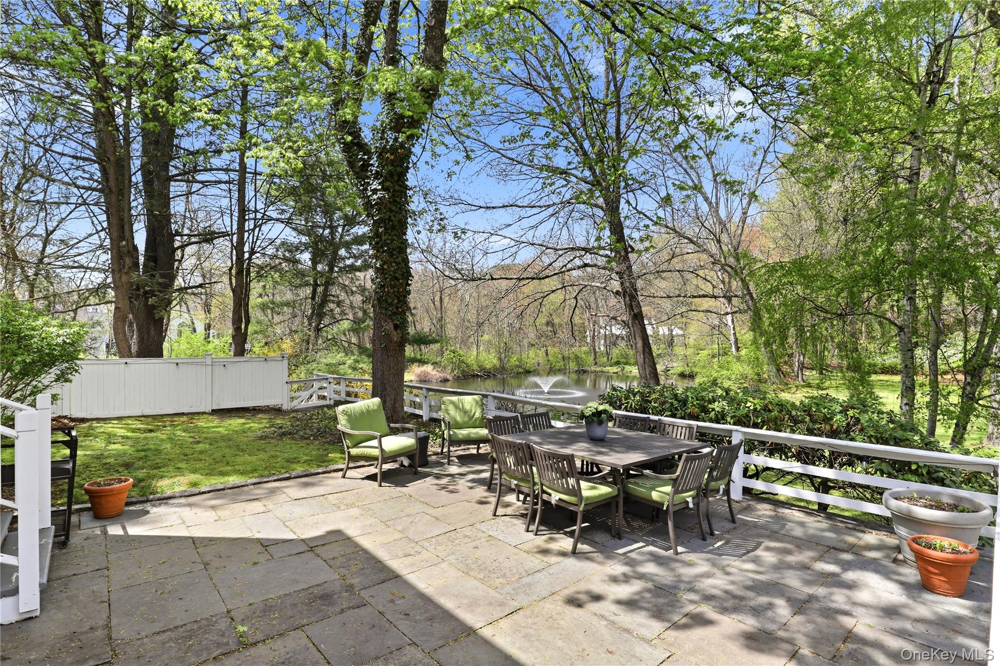576 Old Post Road Bedford, NY 10506 - Photo 4 of 29 a view of backyard with sitting area and garden