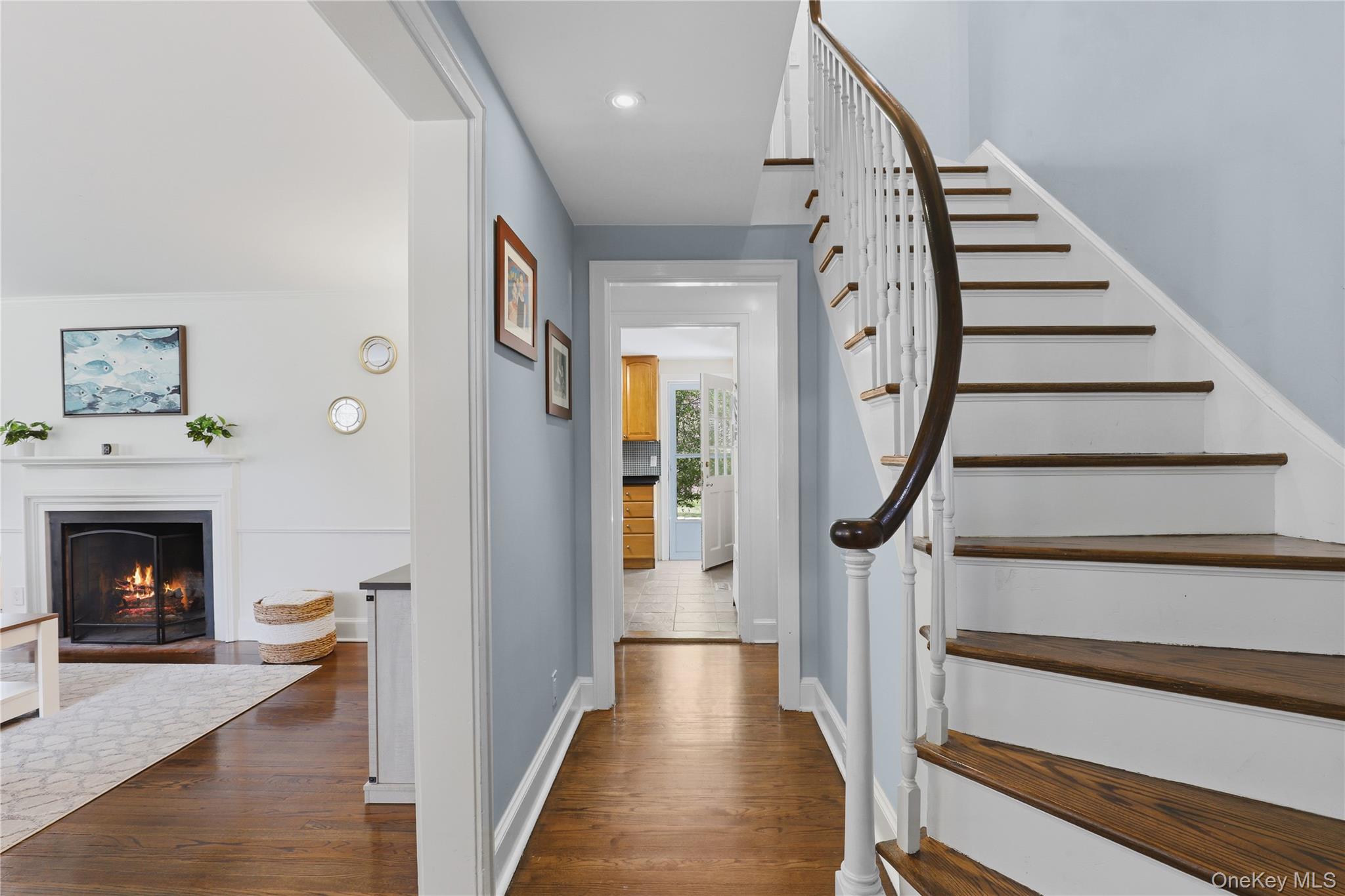 576 Old Post Road Bedford, NY 10506 - Photo 7 of 29 a view of an entryway with wooden floor fireplace and a livingroom