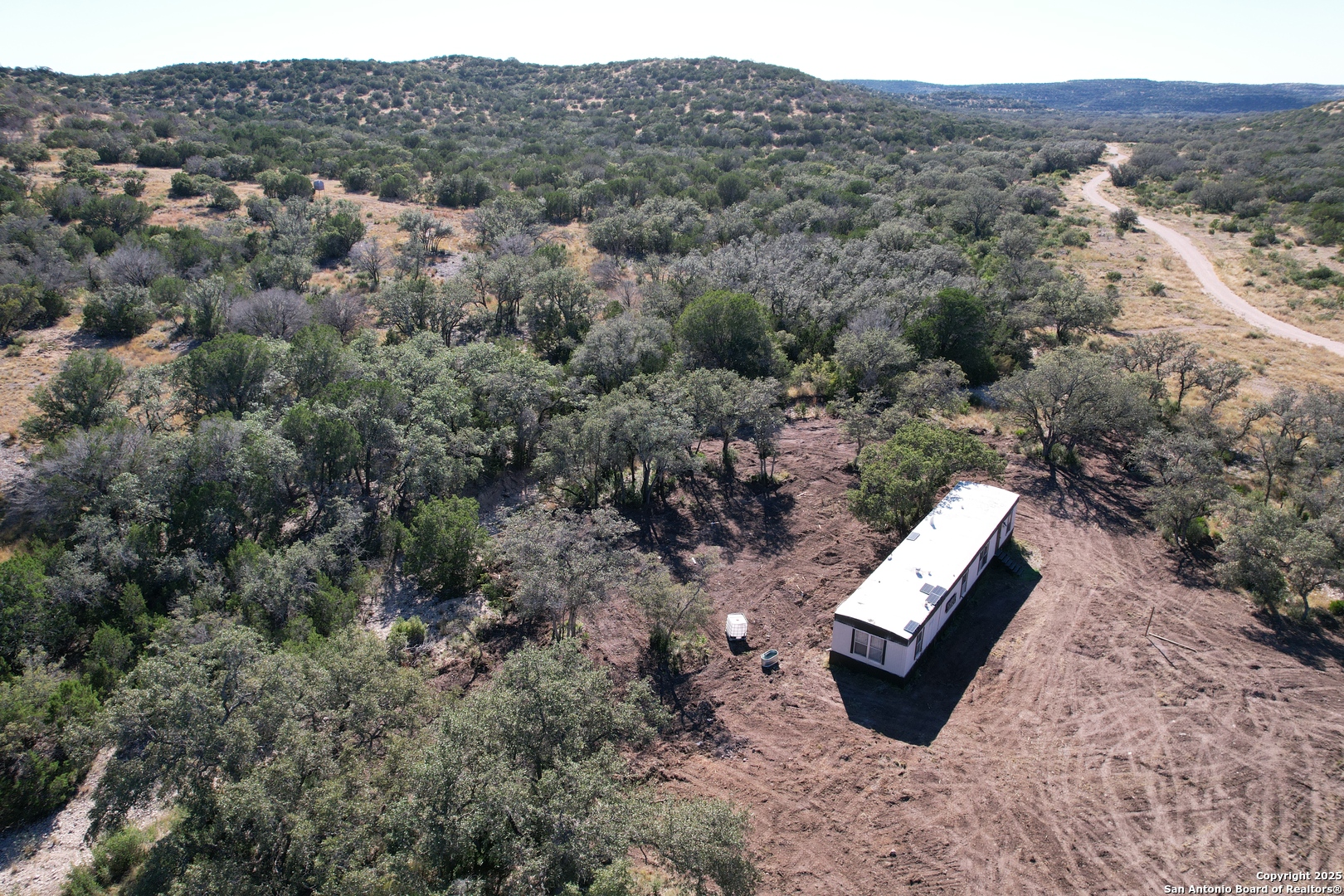 45453 St Rocksprings Tx 78880 Rocksprings, TX 78880 - Photo 11 of 31 an aerial view of a house with a yard