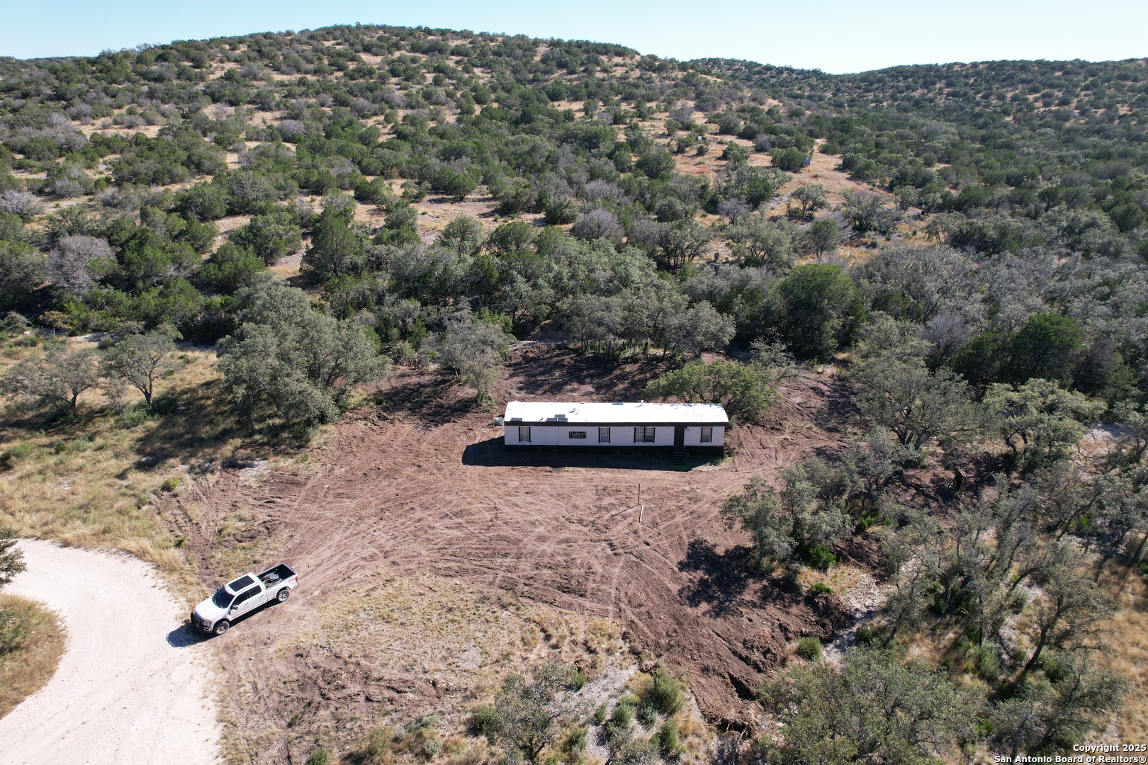 45453 St Rocksprings Tx 78880 Rocksprings, TX 78880 - Photo 10 of 31 an aerial view of a house with a yard