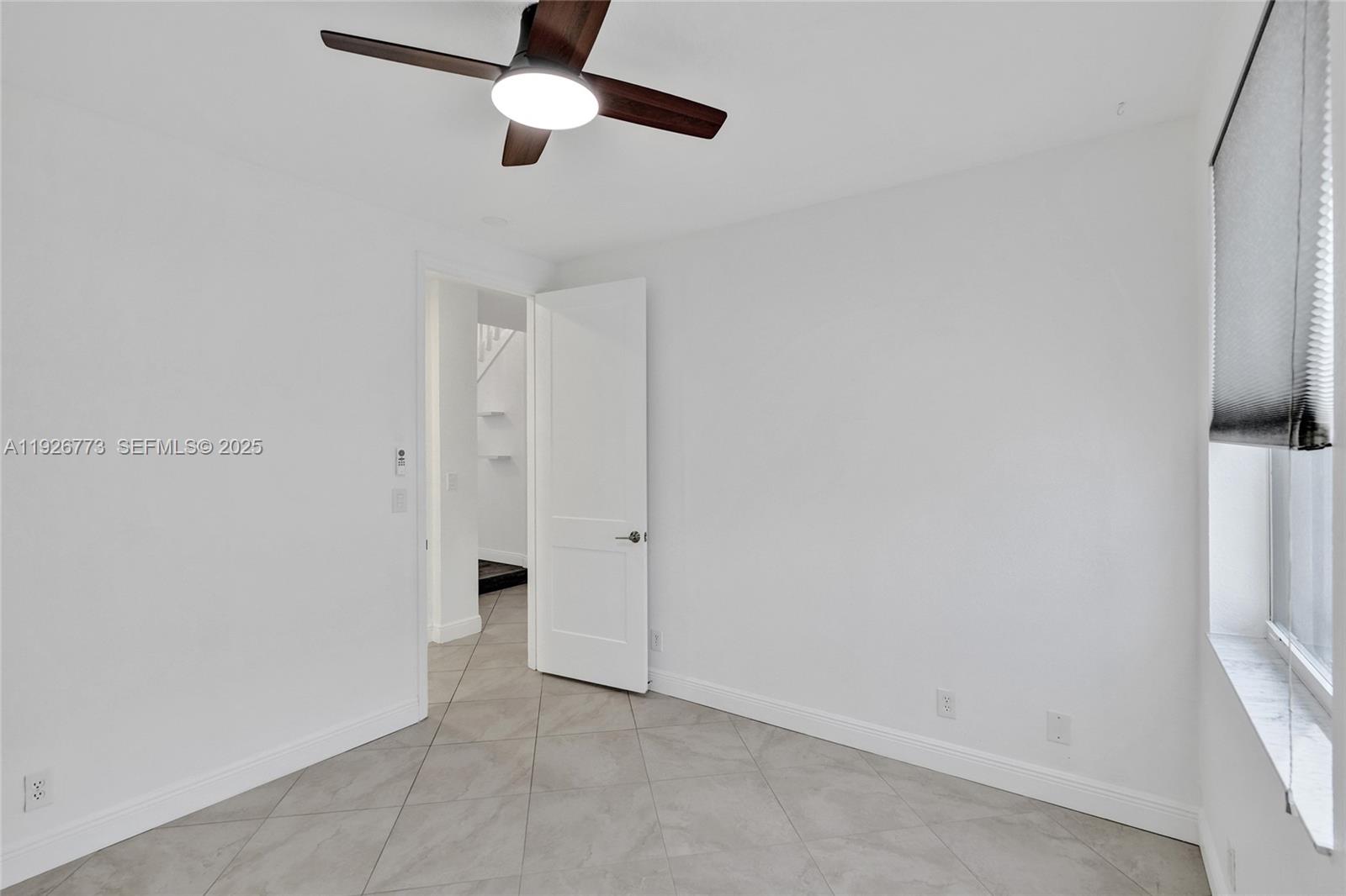 740 Cypress Pointe Drive East Pembroke Pines, FL 33027 - Photo 14 of 46 a view of an empty room with a window