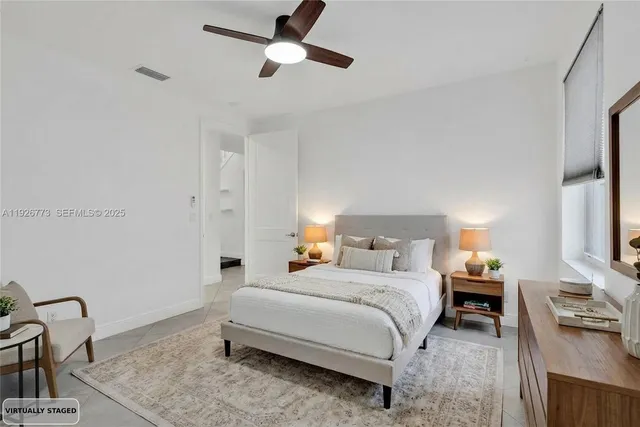 a bedroom with a bed and a dresser with the shoe rack