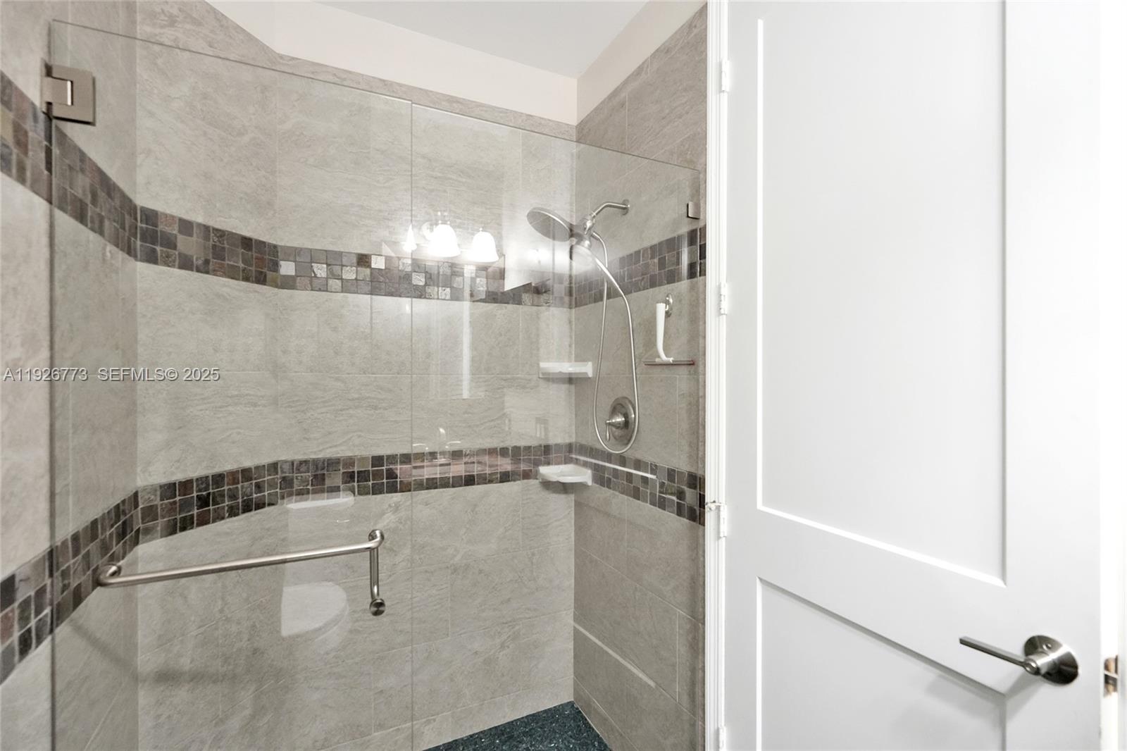 740 Cypress Pointe Drive East Pembroke Pines, FL 33027 - Photo 18 of 46 a bathroom with a shower