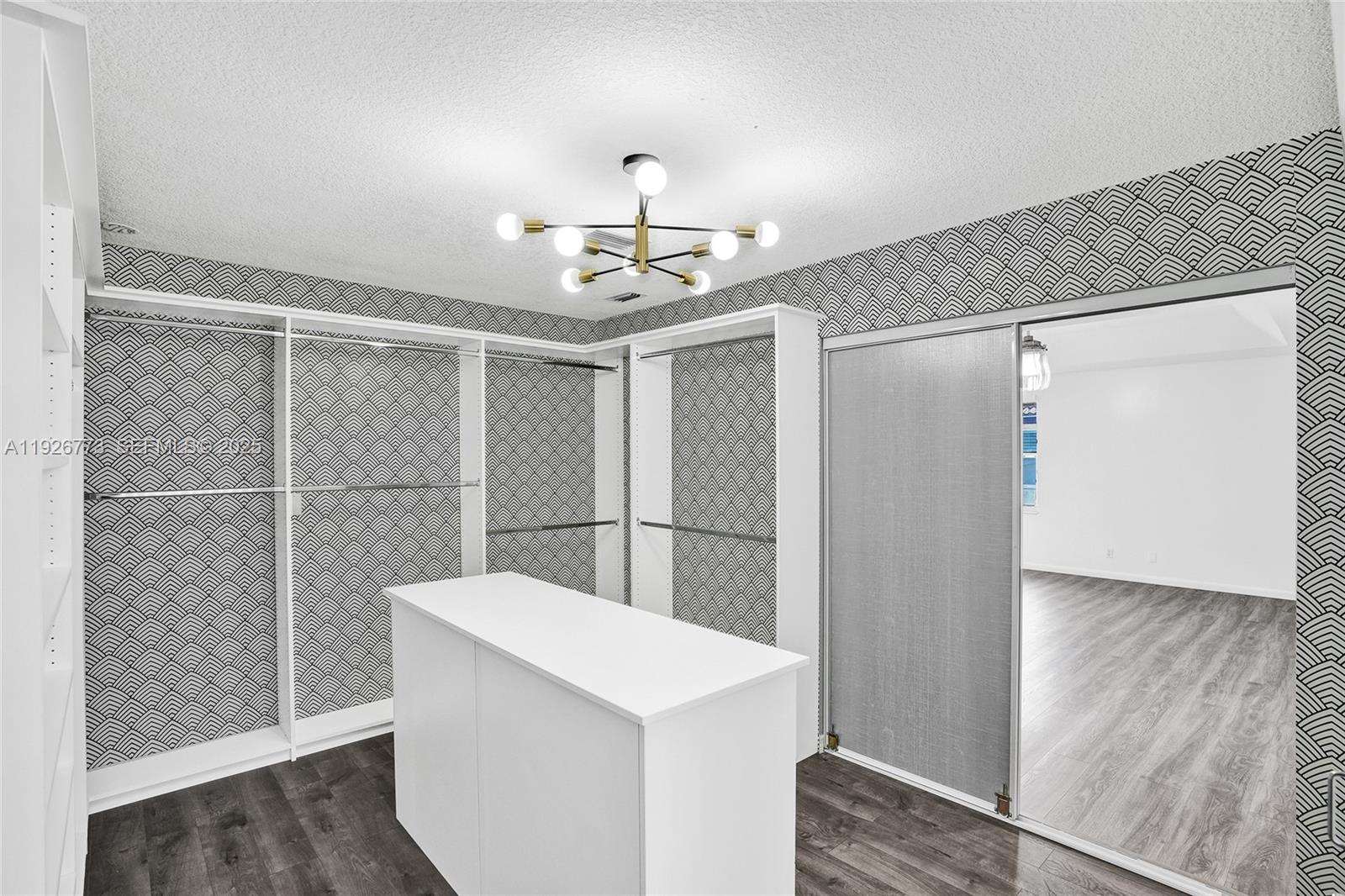 740 Cypress Pointe Drive East Pembroke Pines, FL 33027 - Photo 28 of 46 a view of a refrigerator in kitchen and an empty room