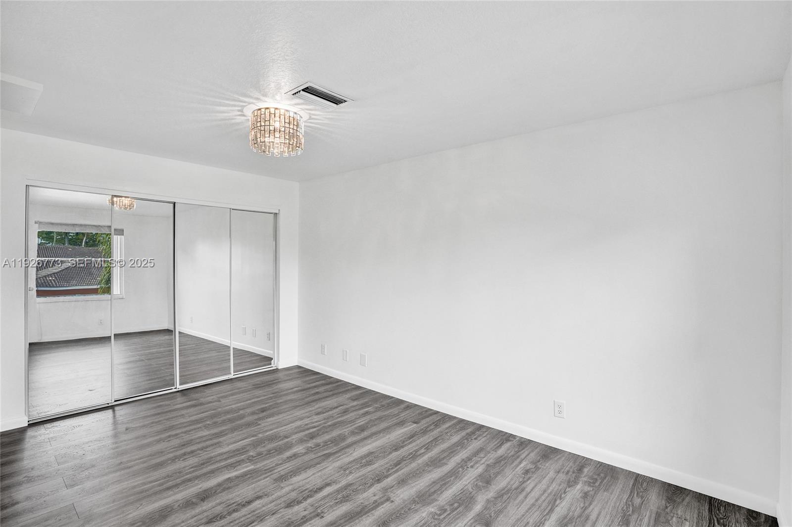 740 Cypress Pointe Drive East Pembroke Pines, FL 33027 - Photo 30 of 46 a view of empty room with wooden floor