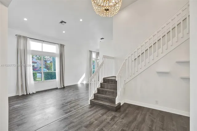 a view of entryway with wooden floor