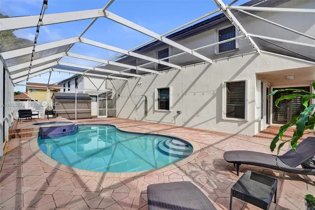 a view of a swimming pool with a patio