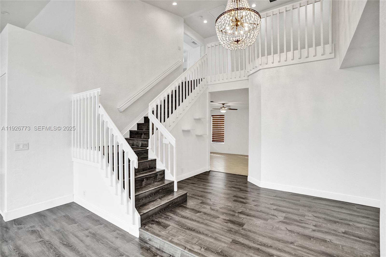 740 Cypress Pointe Drive East Pembroke Pines, FL 33027 - Photo 4 of 46 a view of entryway and hall with wooden floor