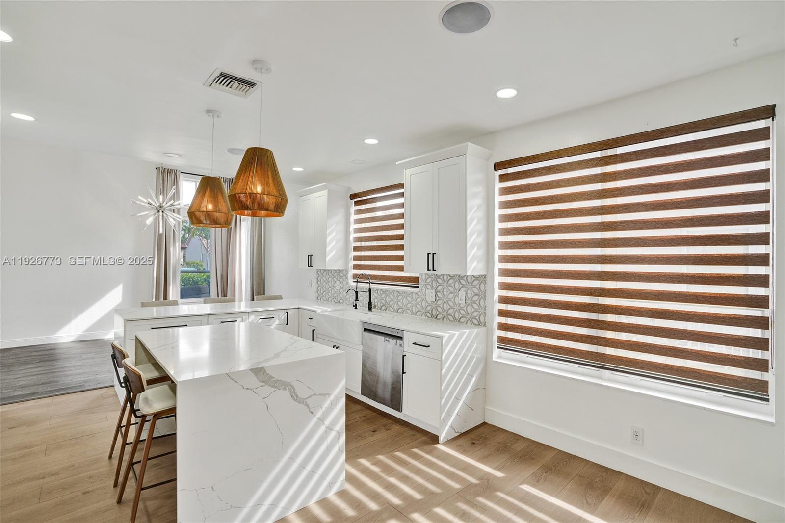 740 Cypress Pointe Drive East Pembroke Pines, FL 33027 - Photo 8 of 46 a kitchen with stainless steel appliances granite countertop a sink and a window