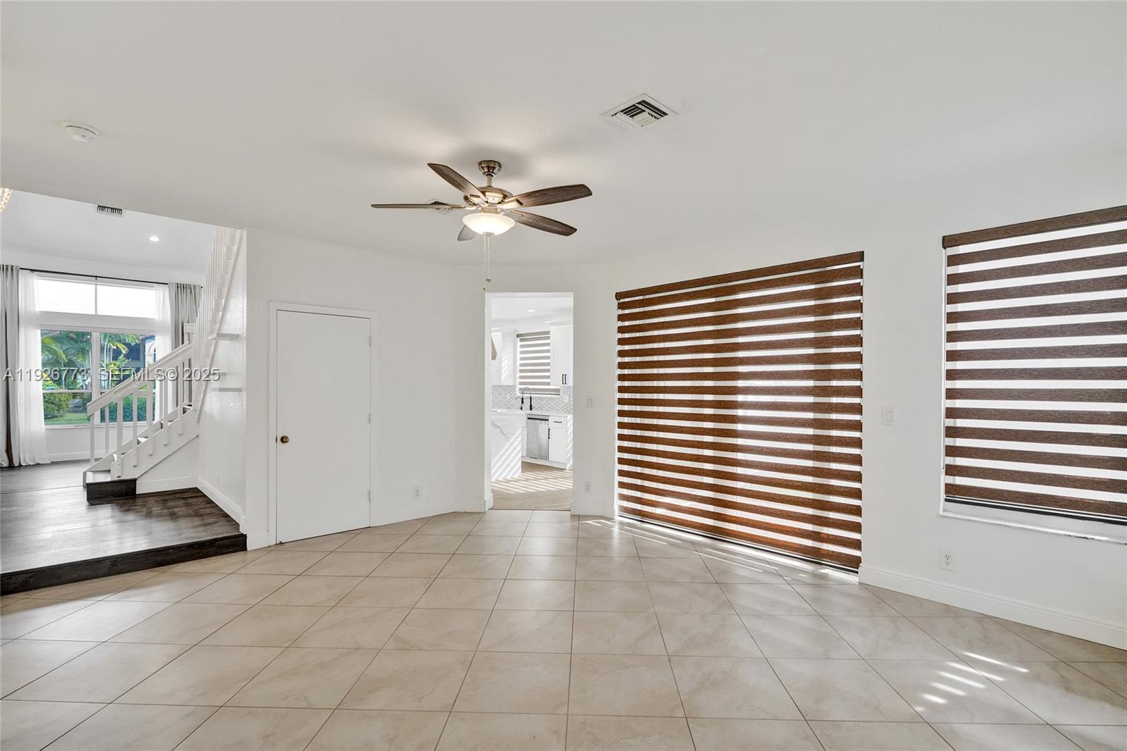 740 Cypress Pointe Drive East Pembroke Pines, FL 33027 - Photo 10 of 46 a view of an empty room with a window