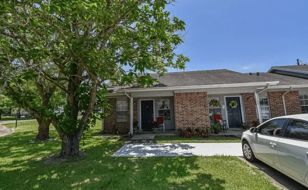 front view of a house with a yard