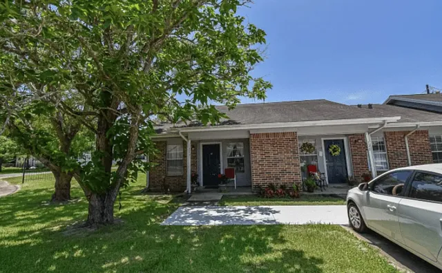 front view of a house with a yard
