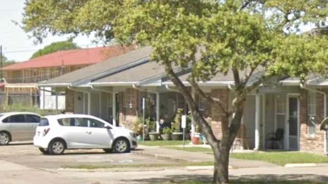 a view of a cars park in front of a house