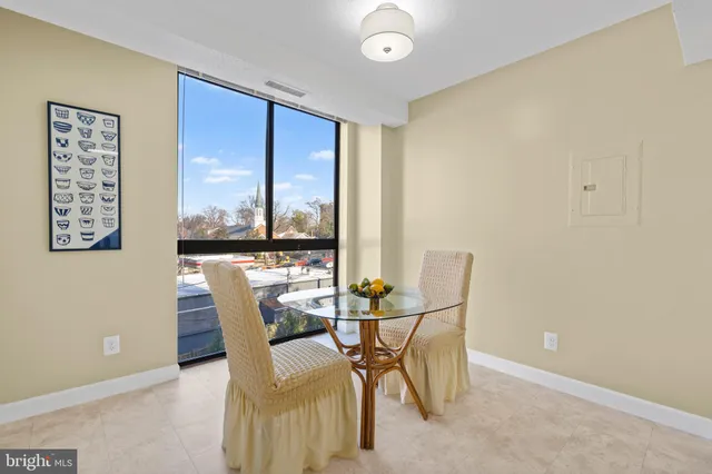 a kitchen with stainless steel appliances granite countertop a sink and a refrigerator