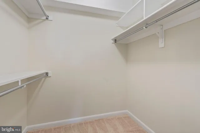 a bathroom with a glass door shower a sink and a mirror