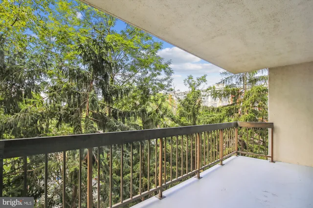 a view of balcony with yard