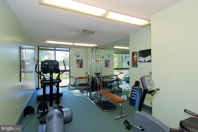 a dinning room with chairs and wooden floor
