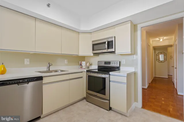 a view of a bedroom with wooden floor and closet