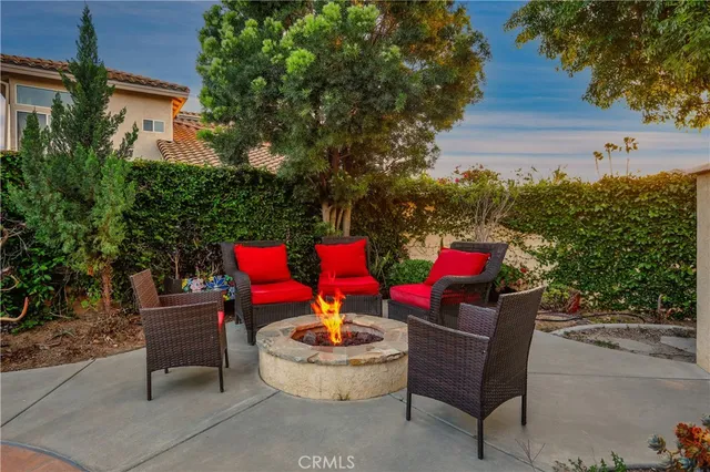 a building outdoor space with patio furniture and potted plants