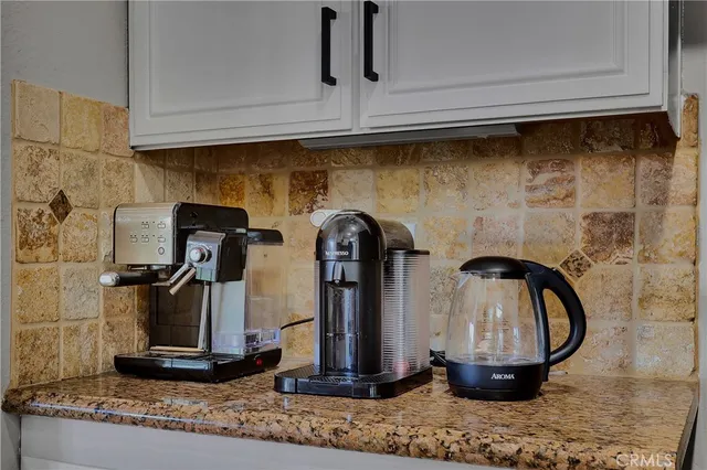 a kitchen with a stove sink and refrigerator