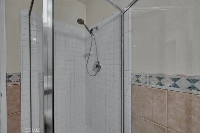 a bedroom with a bed and a desk