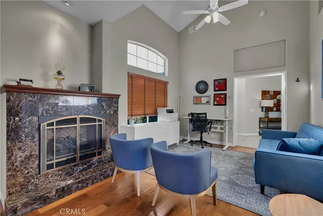 a bedroom with a large bed and a flat screen tv