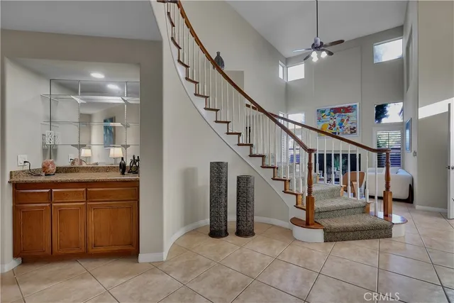 a large bathroom with a large mirror vanity and shower