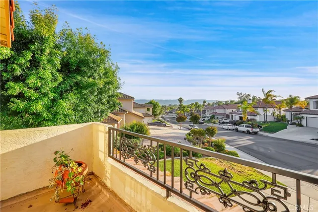 a view of an outdoor dining space with furniture and garden