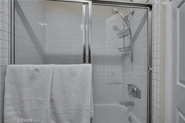 a view of a chairs and table in the backyard