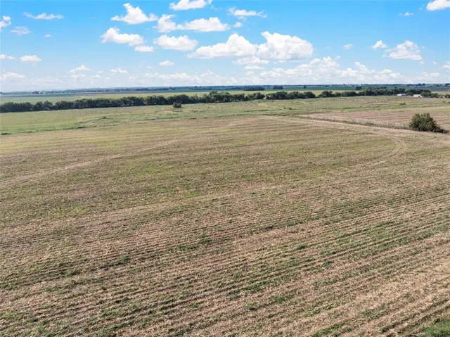 a view of an ocean beach and a mountain