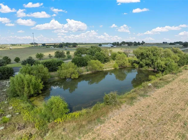 a view of a lake and a yard