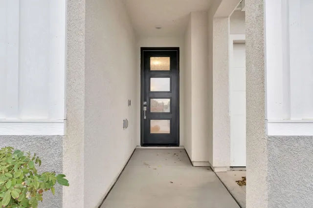 a view of a hallway with front door