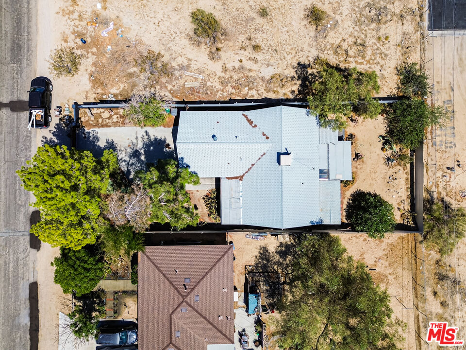 62033 Bonair Road Joshua Tree, CA 92252 - Photo 40 of 53 an aerial view of a house with a yard and garden