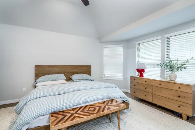a bedroom with a bed and window